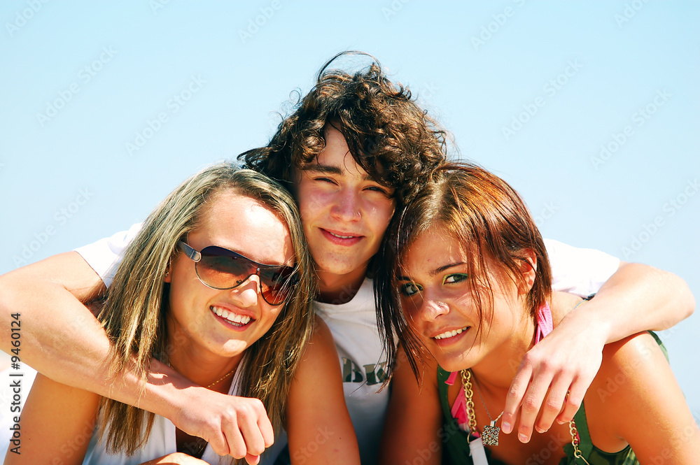 Young attractive friends enjoying together the summer beach Young attractive friends enjoying together the summer beach