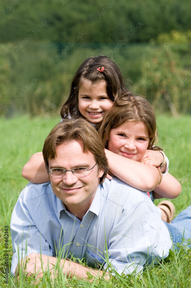 Young father with his two duaghters in a farmer´s field Young father with his two duaghters in a farmer´s field