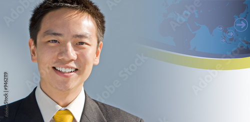 Handsome asian business man with a modern technology background