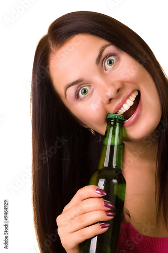 Konstfotografi Young beautiful woman trying to open a bottle of beer