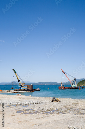 Construction of new seaport(oil harbor).Floating cranes.. © Stanislav Komogorov