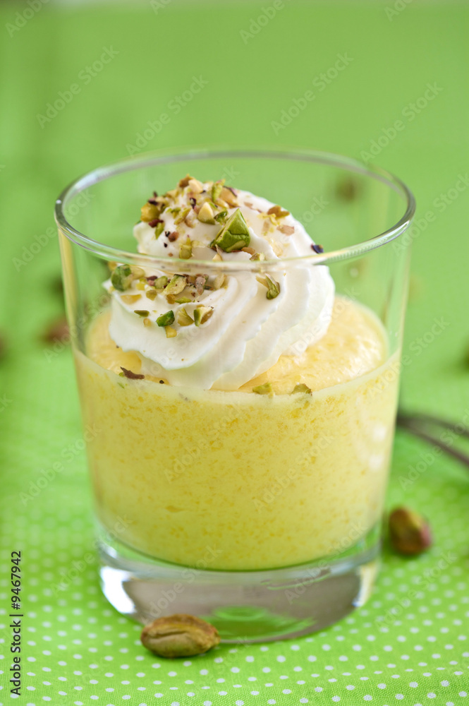 Delicious mango mousse topped with whipped cream Delicious mango mousse topped with whipped cream