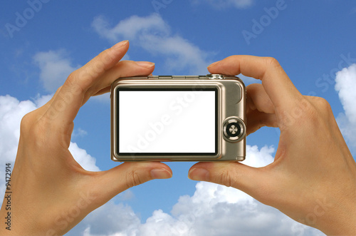 taking a photograph against a sunny blue sky