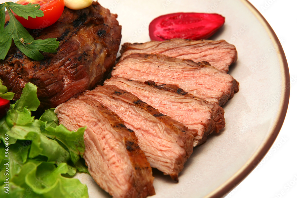 Fototapeta premium grilled meat steak on color dish