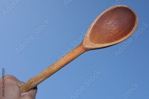 Wooden Spoon Held in Hand