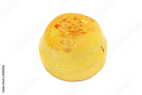 A yellow Shanghai moon cake isolated on white background.