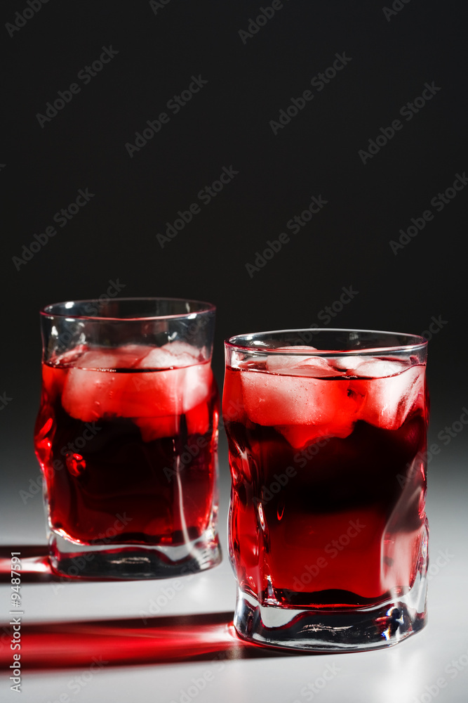 Two beautiful glasses with a cocktail and an ice Two beautiful glasses with a cocktail and an ice