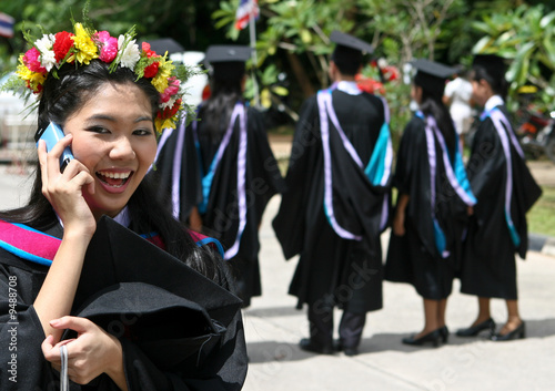 Beautiful Asian university graduates celebrate their success. photo