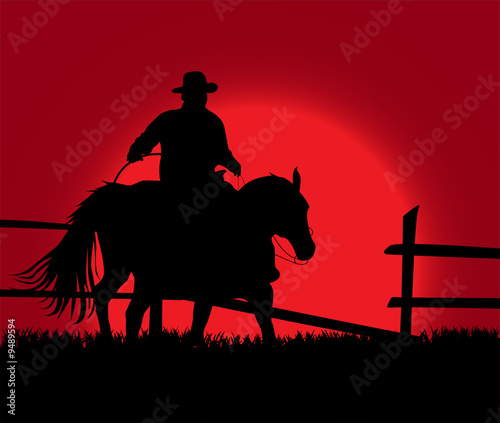 Cowboy over sunset photo