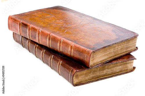Two antique leather books isolated on a white background