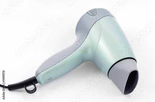 Green hair-dryer on the white background.