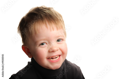 Cute young smiling boy with blond hair and green eyes