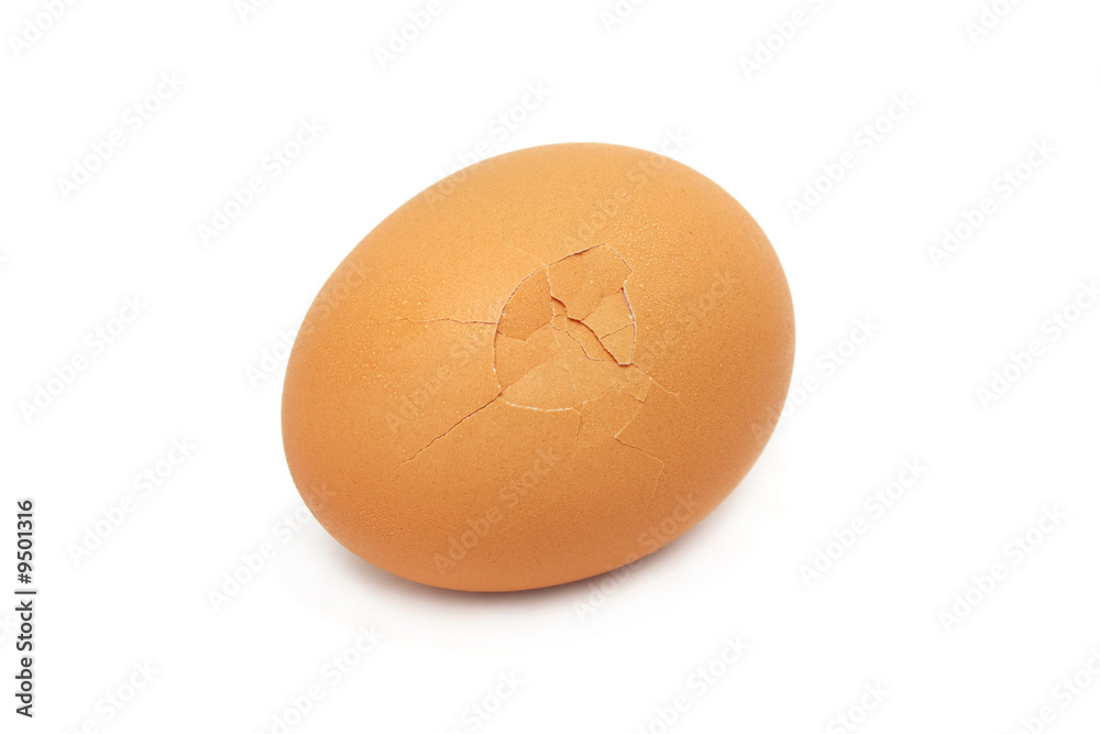 A cracked egg isolated on white background. A cracked egg isolated on white background.