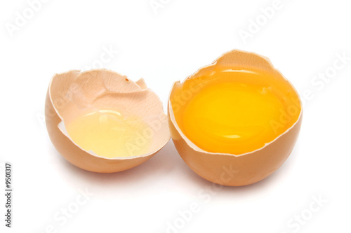 A egg tear in to half with yolk and albumin