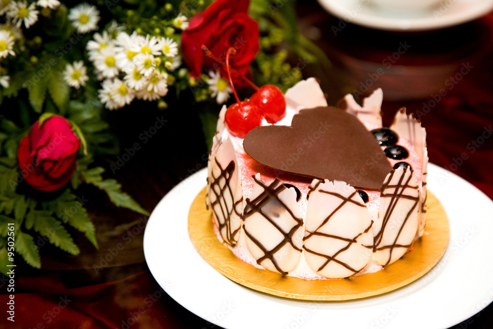 beautiful cake decorated with heart shape chocolate on top beautiful cake decorated with heart shape chocolate on top