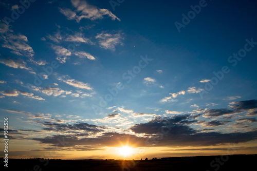 Colorful sunset with cloudscapes as background. Space for text..