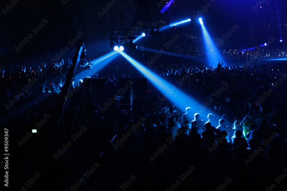 blue spotlight on concert