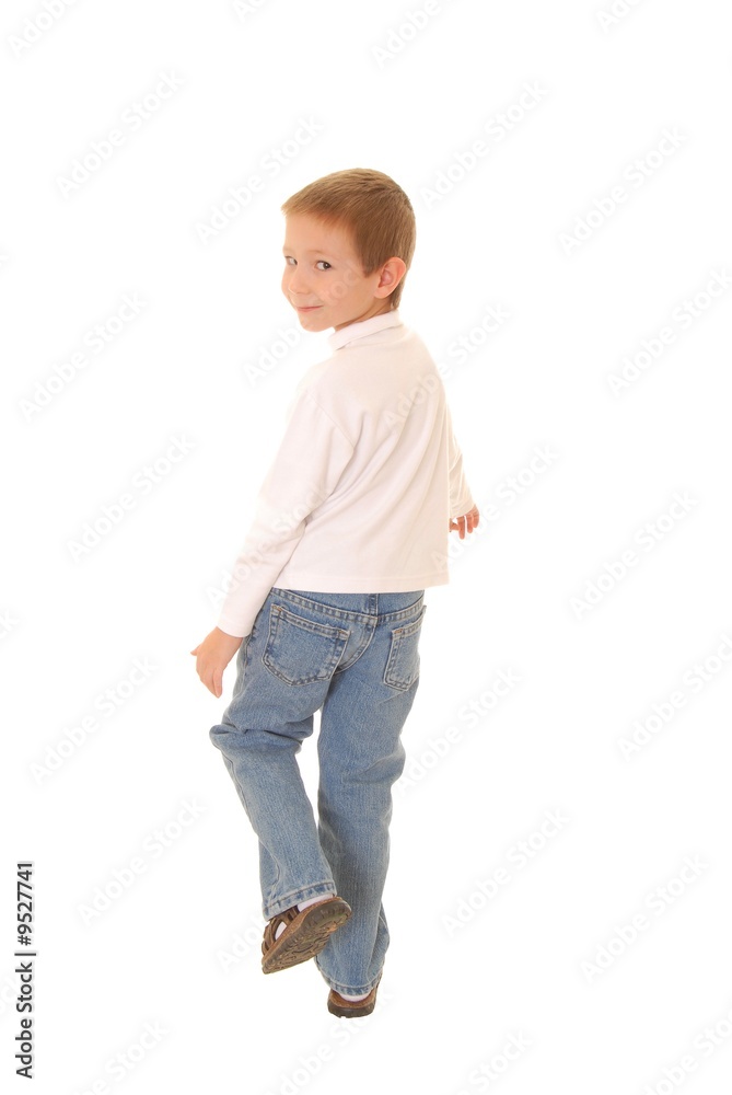 Portrait of a young boy walking away Portrait of a young boy walking away