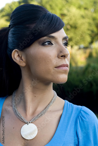 Brunette model with short bangs swept to the side photo