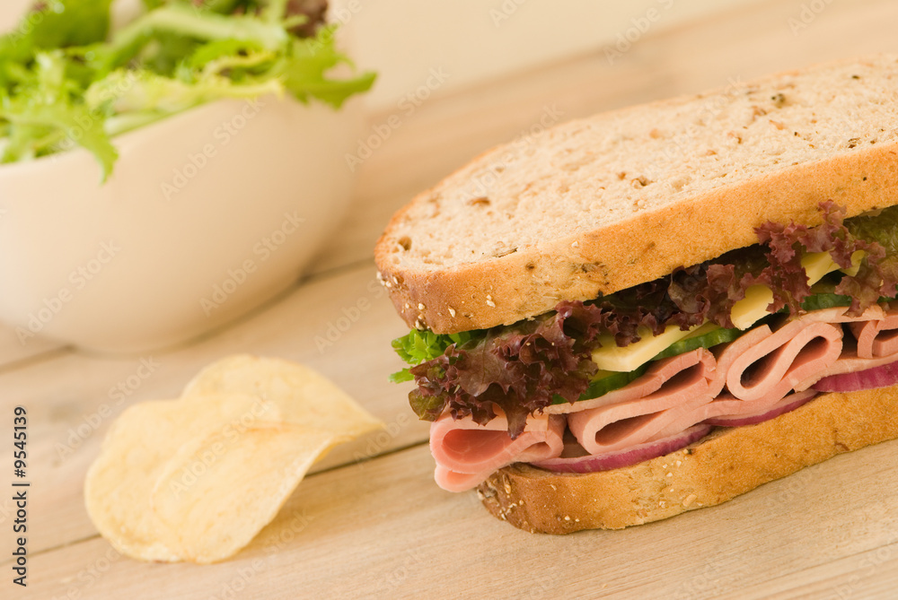 Ham sandwich with salad and potato chips Ham sandwich with salad and potato chips