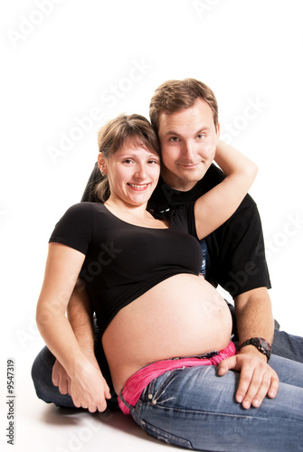 happy pregnant woman and her husband