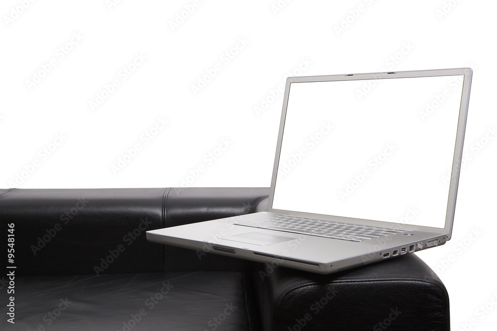 Fototapeta premium Laptop on couch isolated with clipping paths