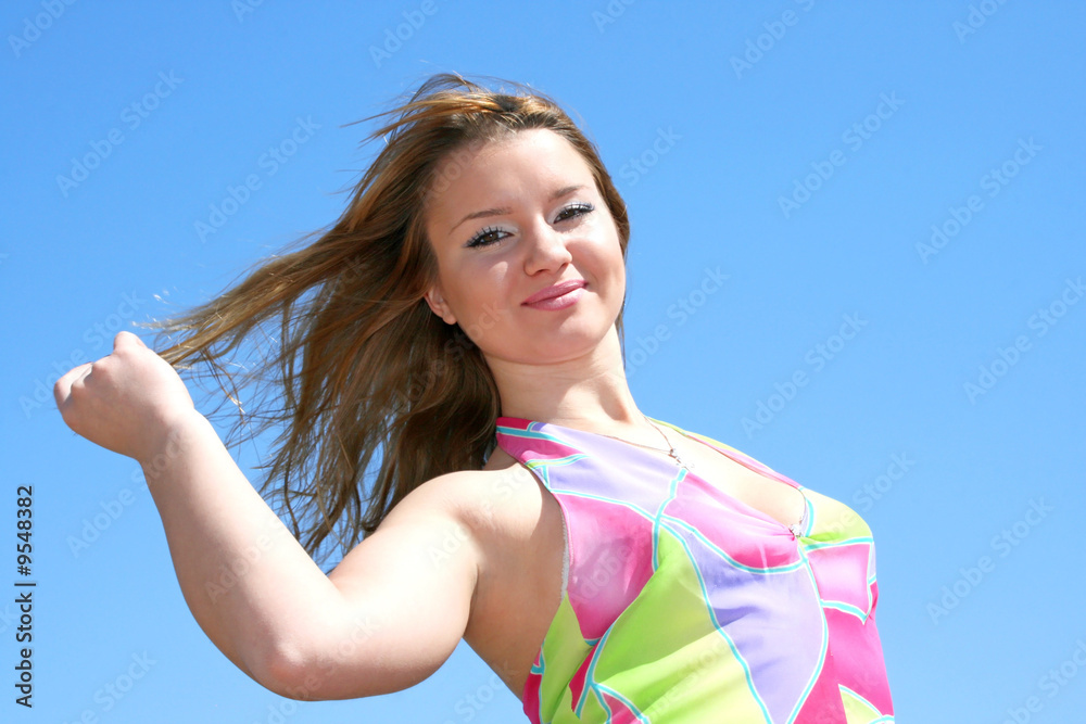 Pretty blond girl in colorful nice dress. Pretty blond girl in colorful nice dress.