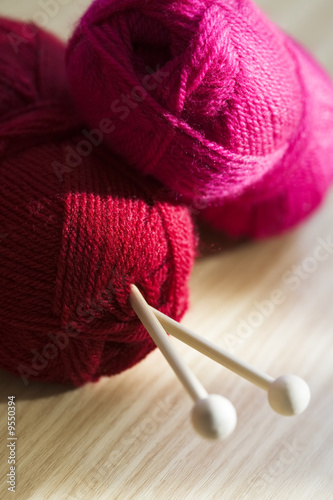 Still life of colored rolls of yarn.