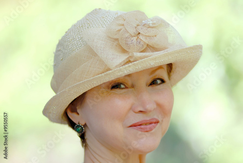 portrait of  woman in  age of in  hat photo