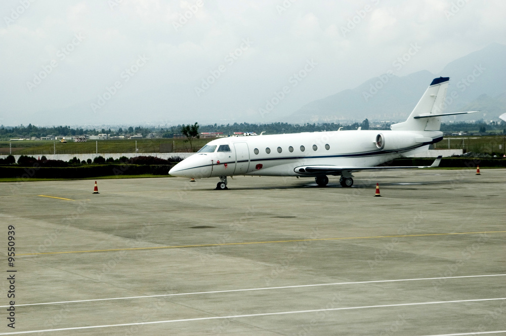 Small jet plane parked at Lijiang airport in Yunnan province