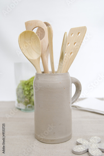 wooden kitchen utensils in a jug
