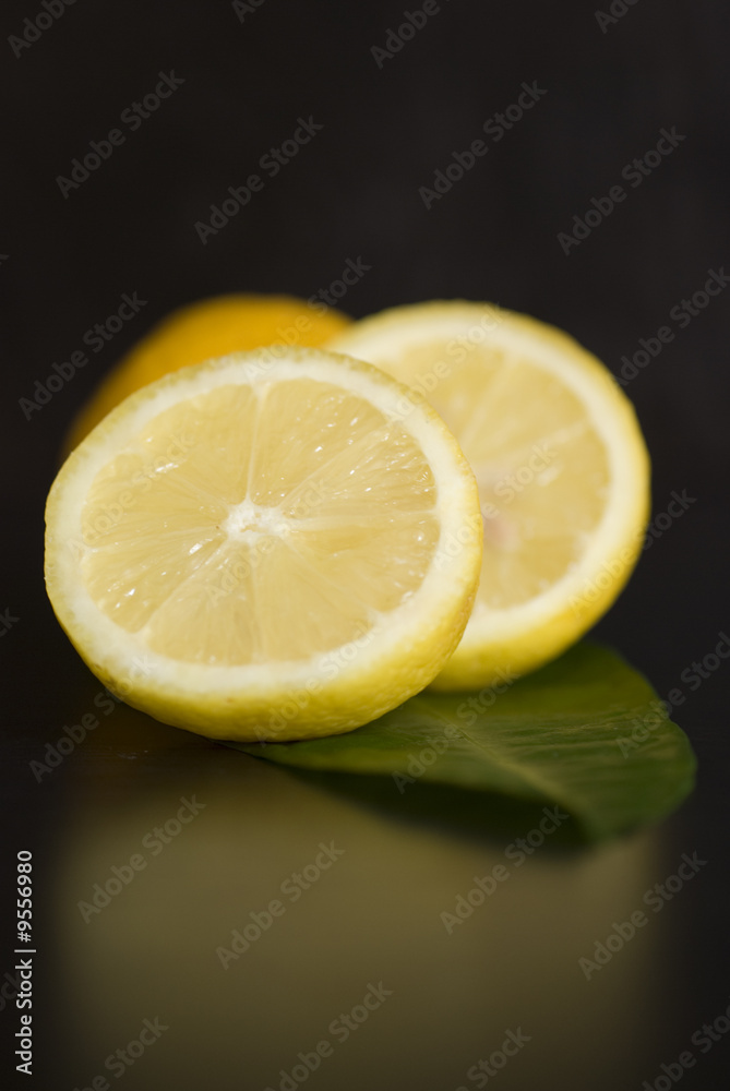 Lemon Fresh fruit, a tropical lemon on black backgroud Lemon Fresh fruit, a tropical lemon on black backgroud