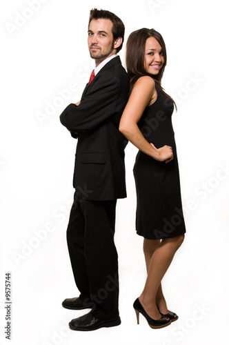 brunette business woman and man standing back to back