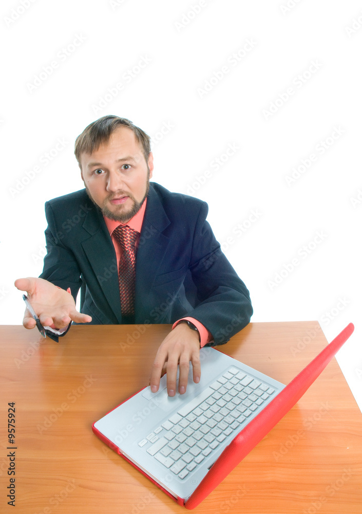 A businessman at his working place, asking question A businessman at his working place, asking question