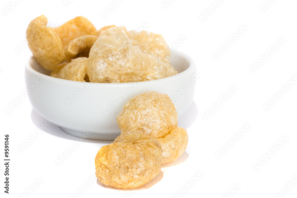 fried pork rinds on a bowl on white background fried pork rinds on a bowl on white background