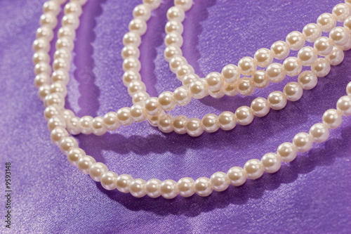 Beads of pearl on the lilac for lady photo