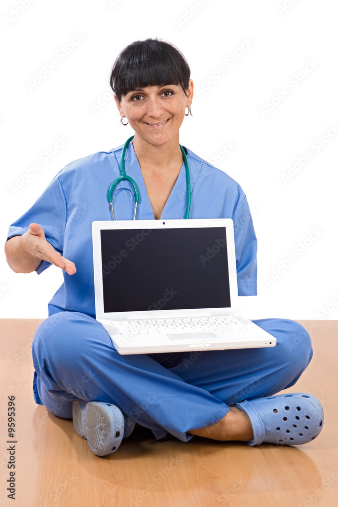 Woman doctor sitting with laptop a over white background Woman doctor sitting with laptop a over white background