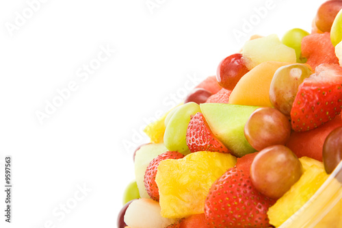 Fresh chopped fruit salad  isolated on white with copyspace.
