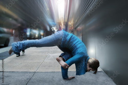 woman in yoga position on the street
