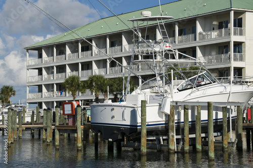 Luxury sailboat parked in a boat slip .