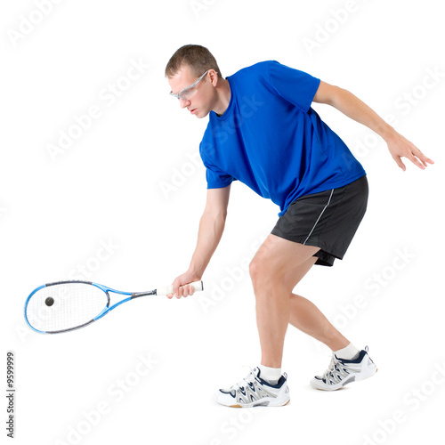 Squash player hitting forehand isolated on white background © Michael Pettigrew
