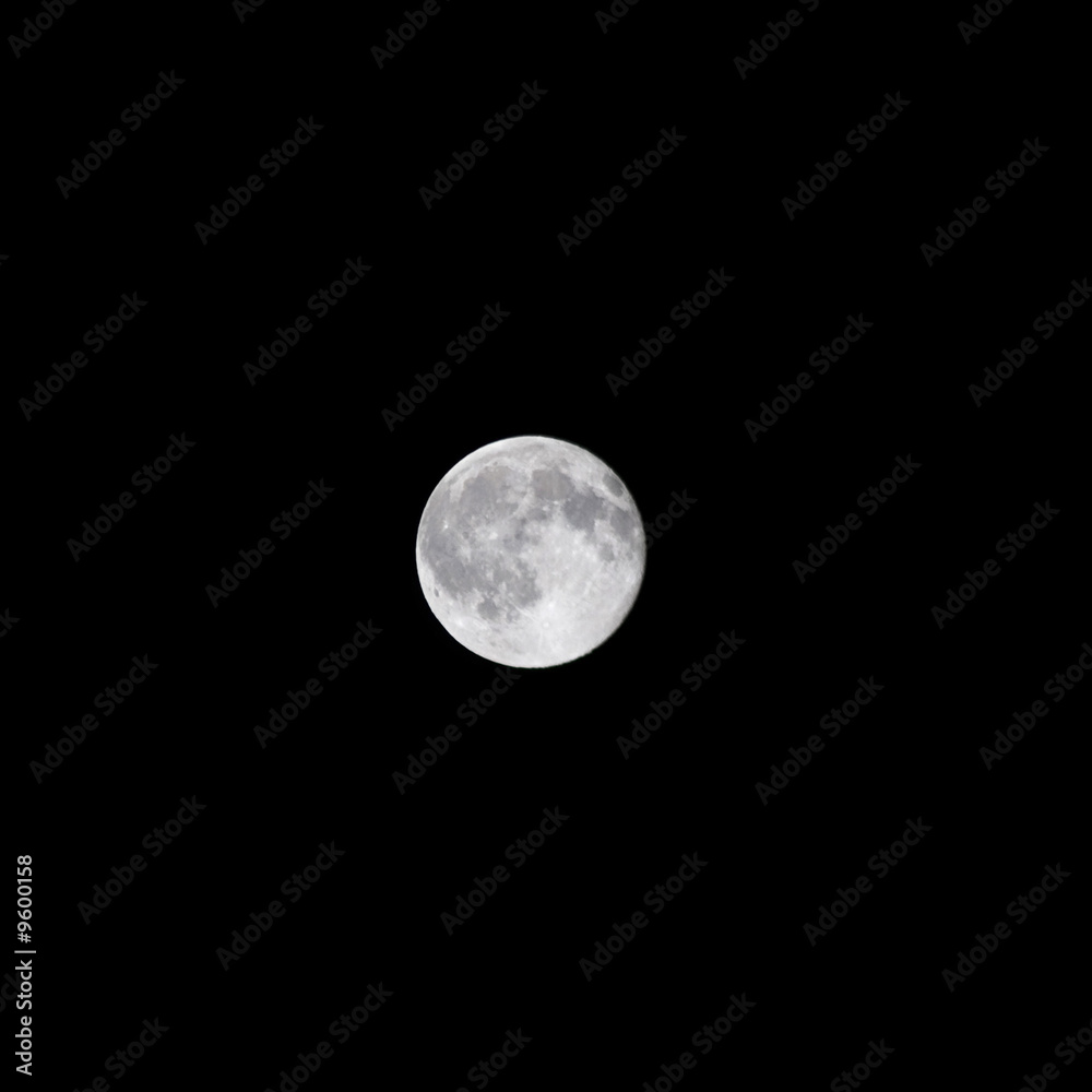 A beautiful harvest moon over a dark night sky. A beautiful harvest moon over a dark night sky.