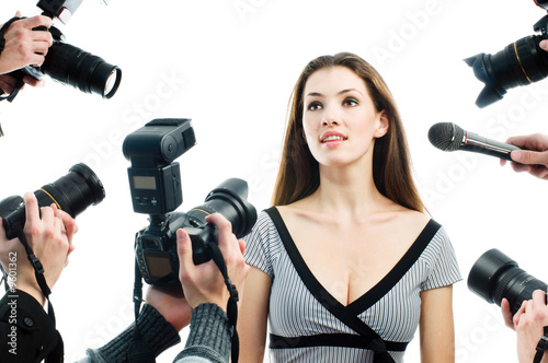 Photograthers are taking a picture of a film star
