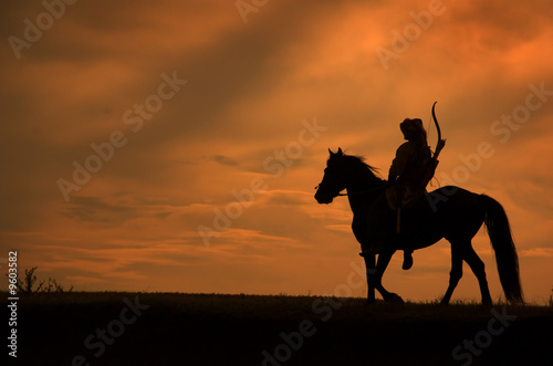 Horsemen riding on the sunset