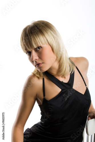 Young emotional woman in black dress