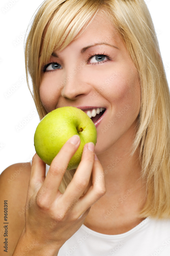 young beautiful blond woman eating apple close up young beautiful blond woman eating apple close up