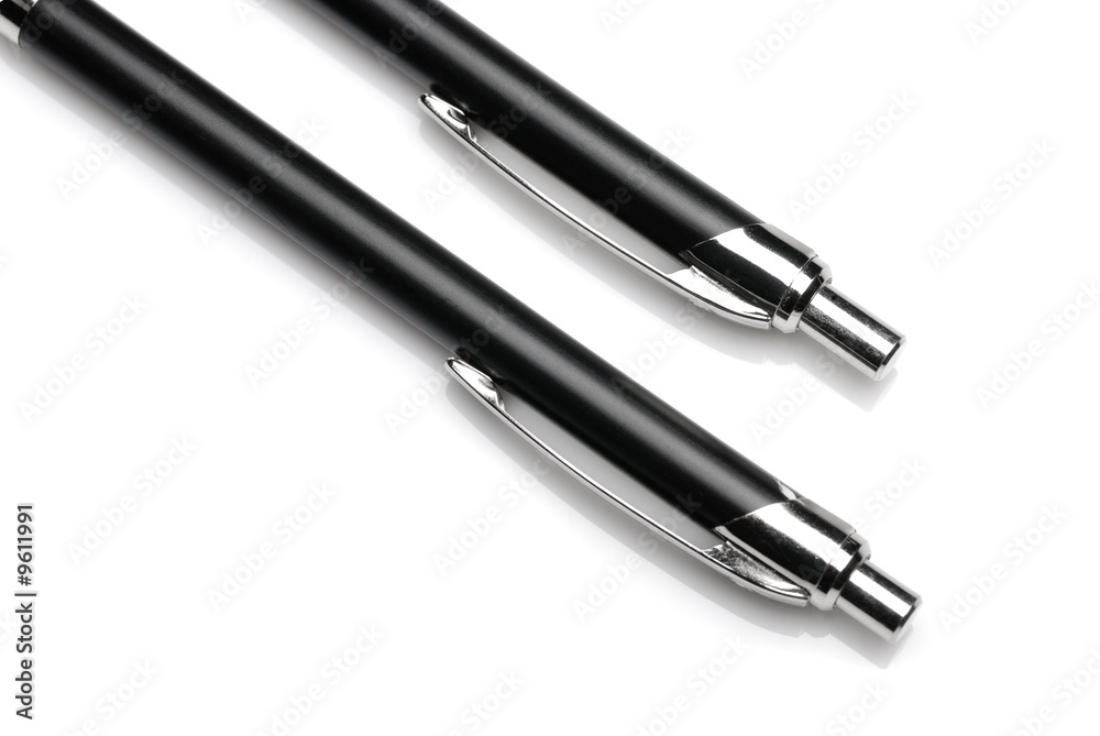 Pen. A set of black ball pens on a light background Pen. A set of black ball pens on a light background
