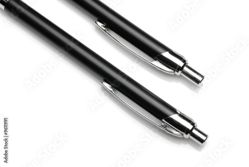 Pen. A set of black ball pens on a light background
