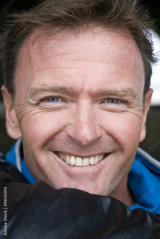 a happy handsome man in his forties a happy handsome man in his forties
