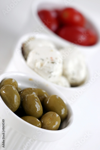 Breakfast with cheese, olive and tomato.